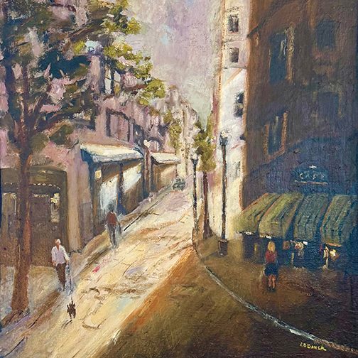 Street scene with contrasting light and shadow.